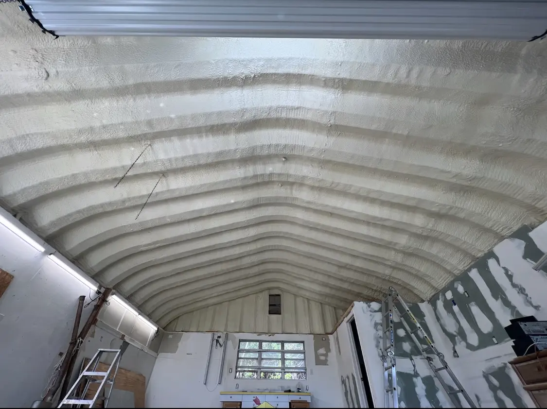 Spray polyurethane foam applied to the underside of a metal roof deck in Lyman